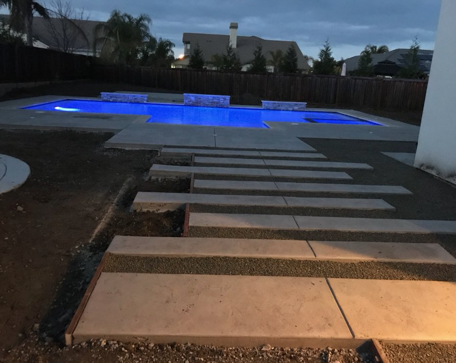 The photo shows the finished concrete slab work in Cerritos.